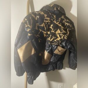 A beautiful vintage, gold and black leather jacket